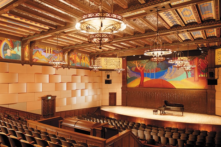 The state-of-the-art Littlefield Concert Hall features stunning murals, intricate ceiling tiles, wrought iron chandeliers, encircled by sound-proofed walls.